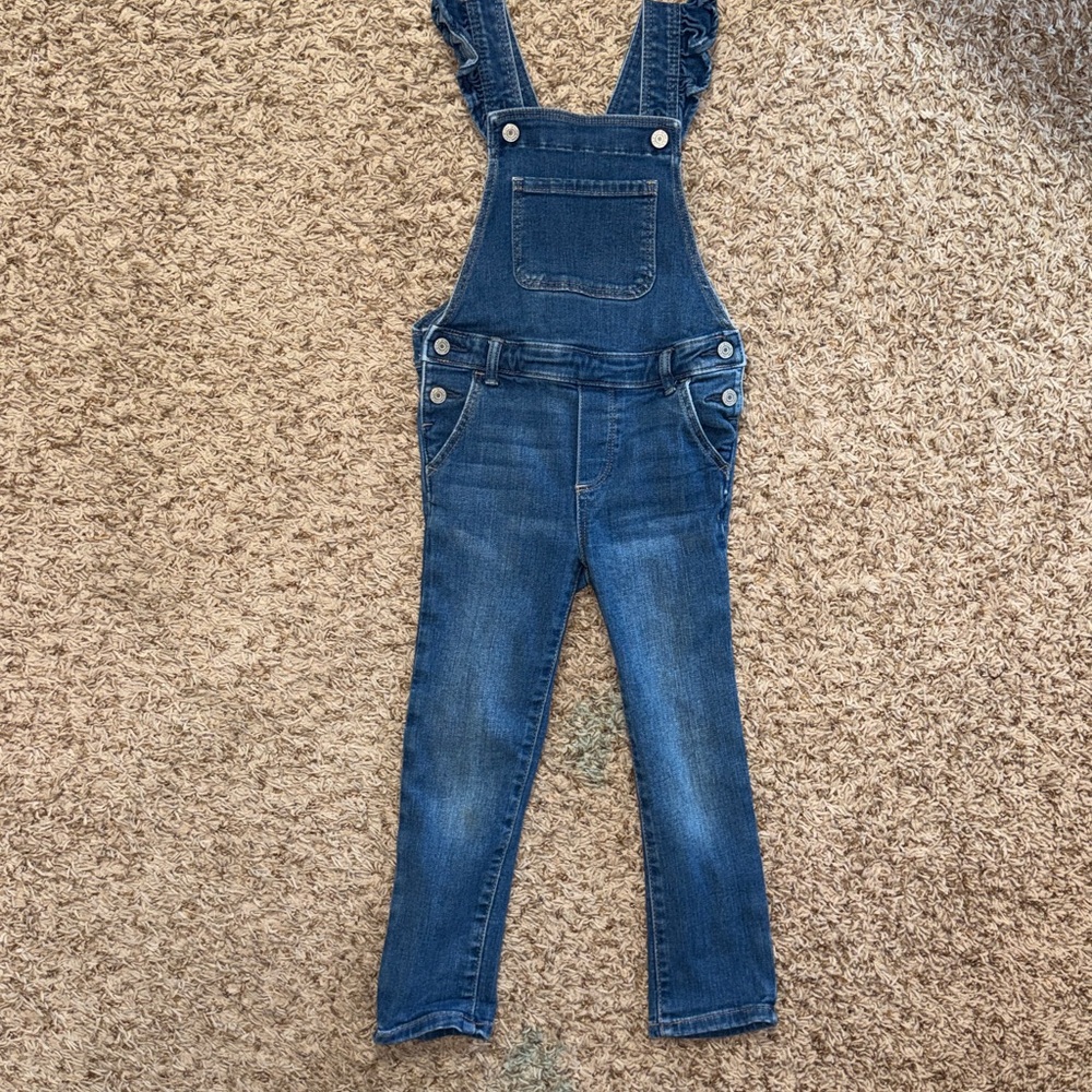 Size 5 girls denim overalls with ruffled shoulder straps from Baby Gap.